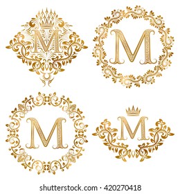 Set of golden letter M vintage monograms featuring heraldic coats of arms and round frames. Perfect for luxury branding, logos, invitations, and classic decorative design.