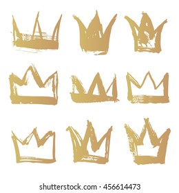 Set golden texture strokes thick paint in the form of a crown isolated on white background