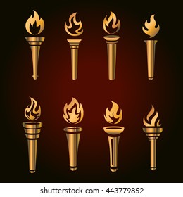 Set of golden torches, flaming gold torch symbol