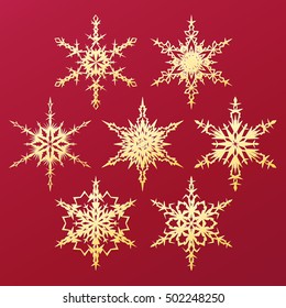 Set of golden vector snowflakes on red background for Christmas and New Year design. Geometric circle shapes. Winter objects. Festive elements. Snowflake icons.