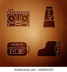 Set Grand piano, DJ remote for playing and mixing music, Music tape player and Metronome with pendulum in motion on wooden background. Vector