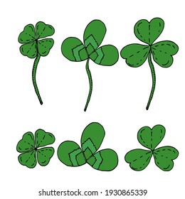 Set of green leaves of clover. Scribble. Four-leaf clover. Element for decoration. Vector illustration isolated on white background.