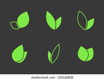 Set of green leaves icons. Isolated on black background. Vector illustration, eps 8.