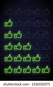 Set of green neon thumbs up rating design elements isolated on dark brick wall. Vector kit of neon thumbs up shapes for ranking interface