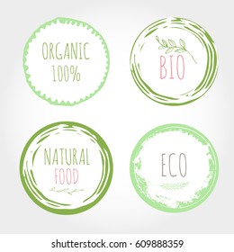 Set of green organic labels with text. Grunge brush eco icons. Vector healthy food badges, tags for cafe, restaurants, products packaging etc. Bio circle frame.