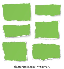 Set of green paper different shapes tears isolated on white background