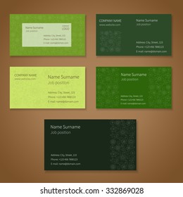 Set of green vector business cards with hand-drawn nature pattern. 