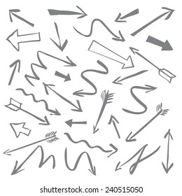A set of grey arrows drawn with a brush. Useful graphic elements for presentations. Isolated Vector Graphics.