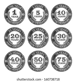 Set of grunge anniversary emblem rubber stamps