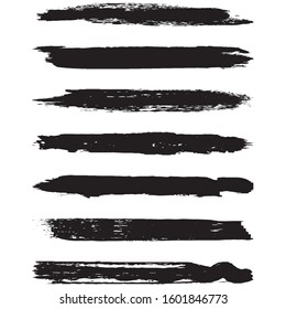 A set of grunge brushes. Dry brush strokes on a white background. Abstract black lines. Ink spots