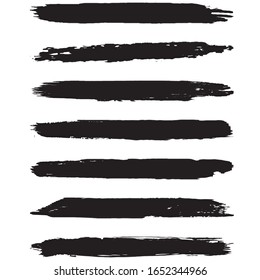 A set of grunge brushes. Dry brush strokes on a white background. Abstract black lines. Ink spots