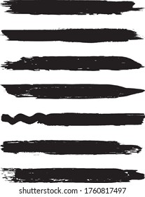 Un conjunto de cepillos de color gris. Golpes secos de pincel sobre un fondo blanco. Resumen de líneas negras. Anuncios de tinta