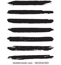 A set of grunge brushes. Dry brush strokes on a white background. Abstract black lines. Ink spots
