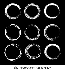 Set of grunge circle. Hand drawn elements.Vector illustration.Art frames. Isolated elements for graphic design.Editable template.White shapes on a black background