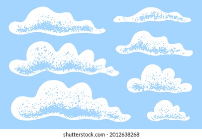 Set of grunge clouds with a grainy texture. Blue sky with clouds.