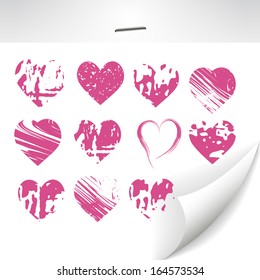 set of grunge hearts on the sheet of paper