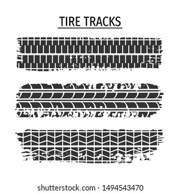 Set of grunge tire tracks isolated on white background. 