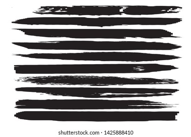 A set of grunge vector brushes. Strokes of black paint on white paper
