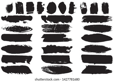 A set of grunge vector brushes. Strokes of black paint on white paper