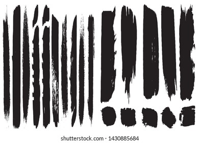A set of grunge vector brushes. Strokes of black paint on white paper