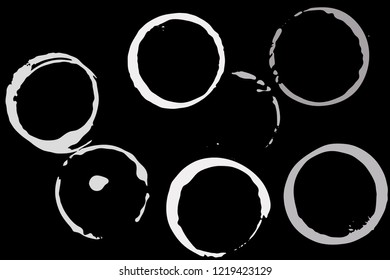 Set of grunge vector cup stains or glass marks isolated on black. Ink, wine, water, paint or other liquid cup stains. Spray splashes collection