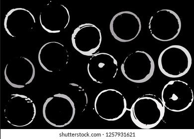 Set of grunge vector cup stains or glass marks isolated on black. Ink, wine, water, paint or other liquid cup stains. Spray splashes collection