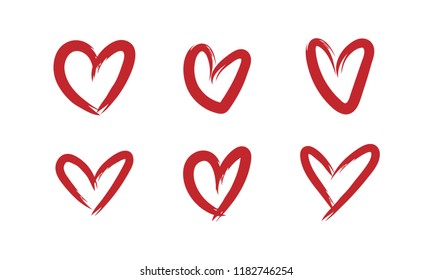 Set of grungy hand drawn hearts. Handmade painted heart shapes.