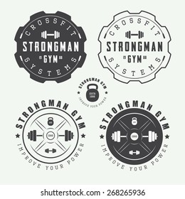 Set of gym logos, labels and slogans in vintage style