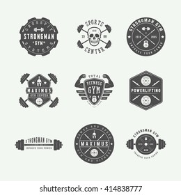 Set of gym logos, labels and slogans in vintage style. Vector illustration
