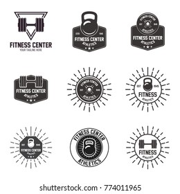Set of gym logos, labels and slogans in vintage style. Vector illustration
