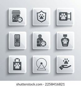 Set Hamster wheel, Hands with animals footprint, Pet shampoo, Shopping bag pet, Bandage plaster, Dog medicine bottle and Veterinary clinic icon. Vector