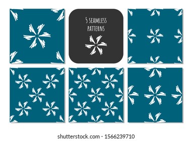 Set of hand draw snowflake seamless patterns with different shapes on blue background for gift paper, decor,  fabric, typography. Artistic collection of doodle elements and ink textures.