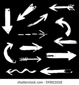 Set of hand drawing comic white color chalk arrows. Hand painting design elements. Vector collection on black background
