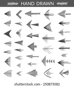 Set of hand drawn arrows. Isolated objects, made with strokes by ink pen, monochromatic. 