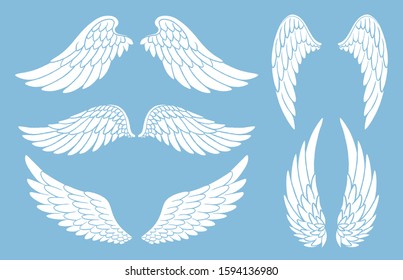 Set of hand drawn bird or angel wings of different shape in open position. Doodle wings white silhouettes set.