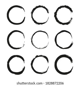 Set of hand drawn black grunge painted round frames isolated on white background.