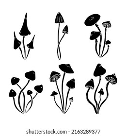 Set of hand drawn black mushrooms. Simple vector illustration of silhouettes.