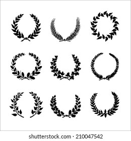 Set of hand drawn black and white silhouette circular laurel foliate and wheat wreaths depicting an award achievement heraldry nobility