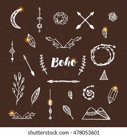 Set of hand drawn boho style elements. Ethnic collection  with arrows, feathers, crystals, flowers, branches, beads. Templates for invitations, cards, scrap booking. Sketch vector illustration. 