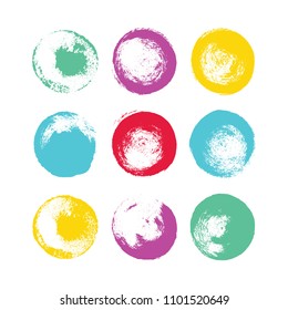 A set of hand drawn brush spots and splashes, ink and paint textures design elements. Colorful grungy circles isolated on white. Vector Illustration EPS 10 file.