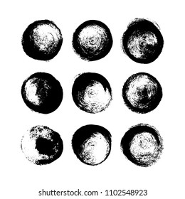 A set of hand drawn brush spots and splashes, ink and paint textures design elements. Black grungy circles isolated on white. Vector Illustration EPS 10 file.