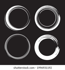 Set of hand drawn calligraphy circle frames. Vector design elements and scribbles. White on black background