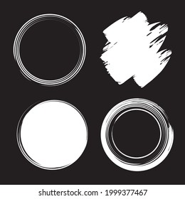 Set of hand drawn calligraphy circle frames. Vector design elements and scribbles. White on black background