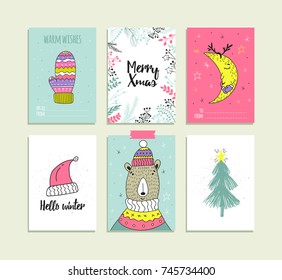 Set of hand drawn christmas card templates. Xmas posters collection. Vector illustration. New Year and winter holiday symbols.