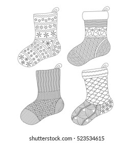 Set of Hand drawn Christmas sock and boot with doodle decorative stars. Black and white pattern for coloring book, holiday greeting cards, print or wrapping paper. Vector illustration.