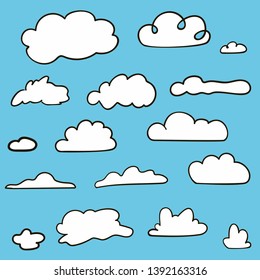 Set of hand drawn clouds on blue background