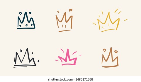 Set of hand drawn crown. Doodles vector illustration.