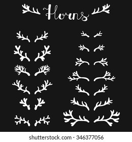 Set of hand drawn deer horns white on the black background, silhouette of antlers