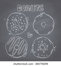 Set of hand drawn donuts isolated on chalkboard background. Sweet lettering. Design for cafe, restaurants, diner menu. Chalk style vector illustration with dessert. 