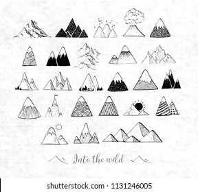 Set of hand drawn doodle sketch mountains on old dirty paper background